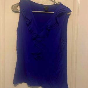 Royal blue blouse with a ruffle detail along the collar.